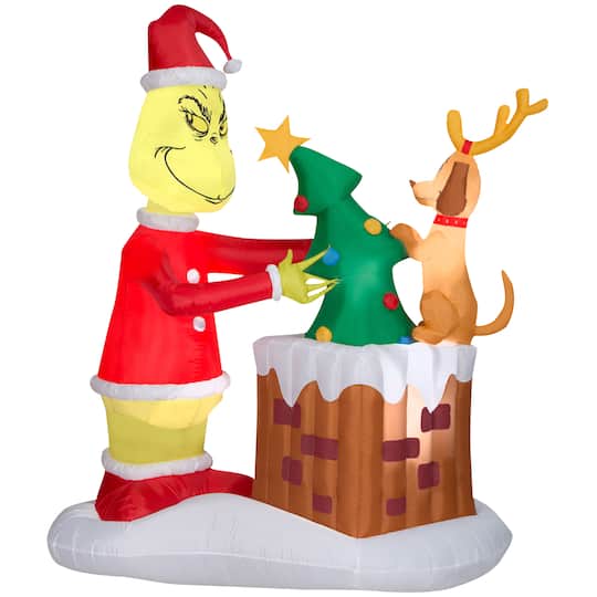 6.5ft. Animated Airblown&#xAE; Inflatable Christmas Grinch Pulling Tree from Chimney